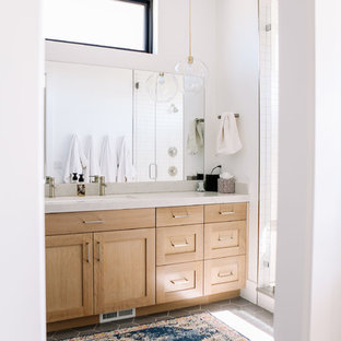 Large minimalist master porcelain tile and gray floor wet room photo in Salt Lake City with shaker cabinets, light wood cabinets, white walls, an undermount sink, quartz countertops, a hinged shower door and white countertops