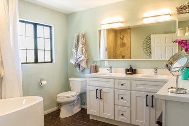 Bathroom - mid-sized traditional master porcelain tile bathroom idea in Los Angeles with quartz countertops, shaker cabinets, white cabinets, a two-piece toilet, green walls and an undermount sink