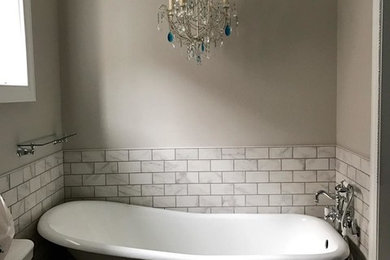 Inspiration for a mid-sized victorian gray tile and porcelain tile mosaic tile floor bathroom remodel in Philadelphia with a two-piece toilet, gray walls and a console sink
