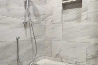 Master gray tile and porcelain tile bathroom photo in Portland with recessed-panel cabinets, white cabinets, an undermount sink and quartzite countertops