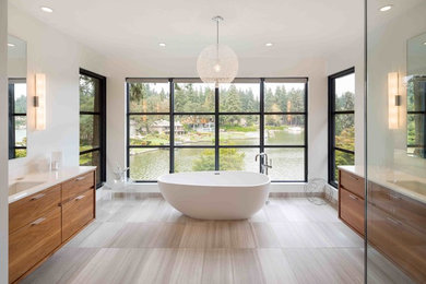 Freestanding bathtub - contemporary master freestanding bathtub idea in Portland with medium tone wood cabinets