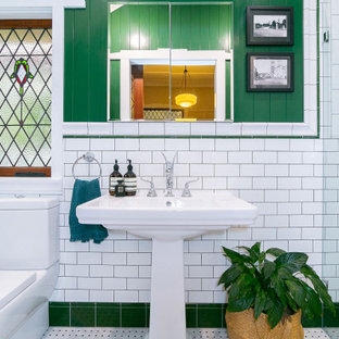 This is an example of a traditional bathroom in Brisbane with an alcove shower, white tile, subway tile, mosaic tile floors, a pedestal sink, grey floor and a single vanity.