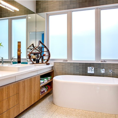 Inspiration for a contemporary freestanding bathtub remodel in Houston with a vessel sink