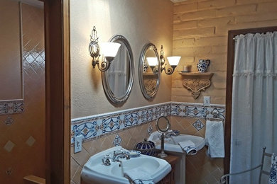 Mid-sized southwest master multicolored tile and cement tile terra-cotta tile doorless shower photo in Other with a two-piece toilet, multicolored walls and a pedestal sink