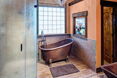 Example of a southwest master brown tile and glass tile dark wood floor and brown floor bathroom design in Other with orange walls, a vessel sink, a hinged shower door, furniture-like cabinets, dark wood cabinets, a two-piece toilet and granite countertops