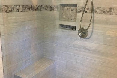 Example of a mid-sized gray tile and porcelain tile porcelain tile and white floor bathroom design in Other