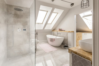 Example of a trendy master gray floor bathroom design in New York with white walls, a vessel sink, beige countertops and a bidet