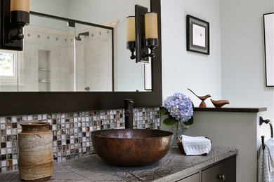 Alcove shower - mid-sized contemporary master mosaic tile and gray tile porcelain tile and gray floor alcove shower idea in New York with soapstone countertops, a vessel sink, flat-panel cabinets, brown cabinets, a one-piece toilet, blue walls, a hinged shower door and gray countertops