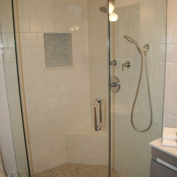 Spacious corner shower with frameless glass door, separate hand-shower, built-in