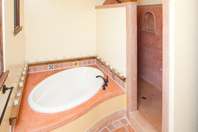 Bathroom - large southwestern master orange tile bathroom idea in Santa Barbara with beige walls