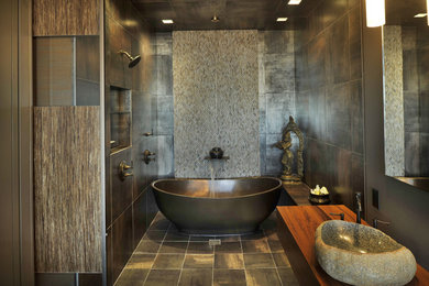 Inspiration for a bathroom remodel in Nashville with wood countertops