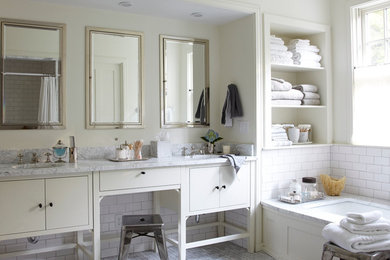 Inspiration for a transitional white tile and subway tile alcove bathtub remodel in Boston with furniture-like cabinets and white cabinets