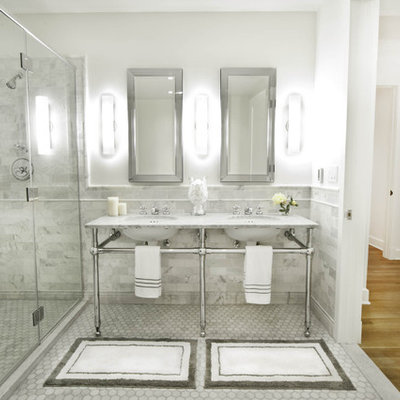 Bathroom - large traditional master subway tile and gray tile marble floor and gray floor bathroom idea in New York with open cabinets, a one-piece toilet, white walls, a pedestal sink, marble countertops, a hinged shower door and gray countertops