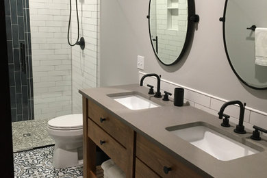 Inspiration for a transitional bathroom remodel in Kansas City with medium tone wood cabinets, gray countertops and a freestanding vanity