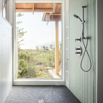 Walk-in shower - large contemporary master white tile and porcelain tile slate floor walk-in shower idea in Portland Maine with flat-panel cabinets, green cabinets, a wall-mount toilet, white walls, an undermount sink and granite countertops