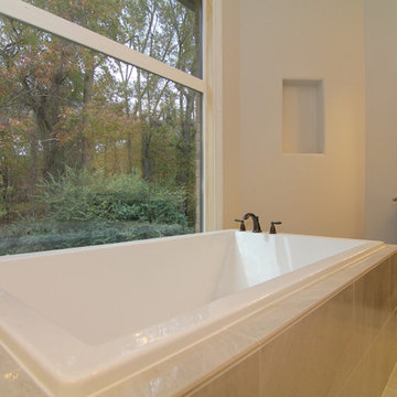 Square tub with backyard overlook