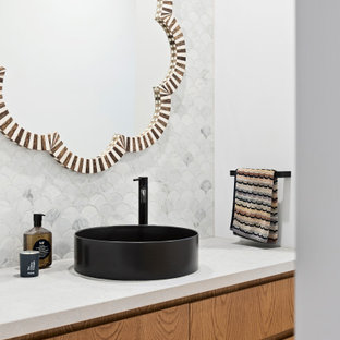 This is an example of a mid-sized contemporary kids bathroom in Other with flat-panel cabinets, dark wood cabinets, an open shower, white walls, marble benchtops, beige floor, white benchtops, a single vanity, a floating vanity, gray tile, porcelain tile, light hardwood floors and a vessel sink.