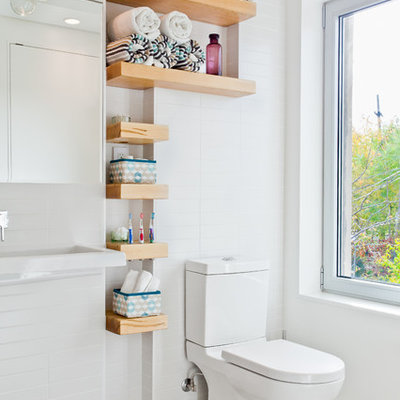 Inspiration for a small contemporary white tile and subway tile bathroom remodel in Toronto with open cabinets and a two-piece toilet