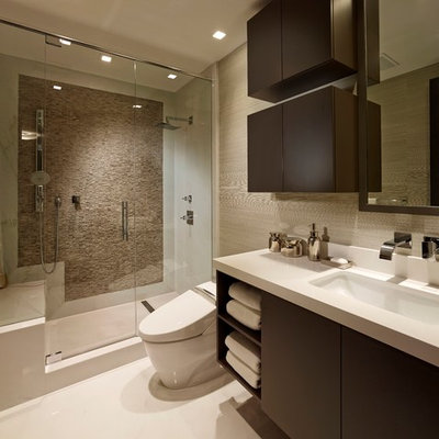 Alcove shower - contemporary beige tile alcove shower idea in Miami with flat-panel cabinets and dark wood cabinets