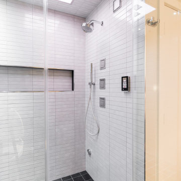 Stand up Shower featuring Kohler Shower Panel, Jets, Handshower and Speakers