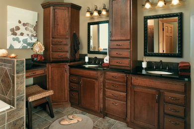 Large elegant master slate floor drop-in bathtub photo in Chicago with shaker cabinets, medium tone wood cabinets, beige walls and an undermount sink