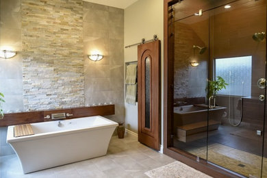 This is an example of a traditional ensuite bathroom in Austin with a freestanding bath.