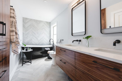 Inspiration for a mid-sized contemporary master gray tile and porcelain tile porcelain tile and gray floor bathroom remodel in Montreal with flat-panel cabinets, dark wood cabinets, a one-piece toilet, gray walls, an undermount sink, quartzite countertops and white countertops