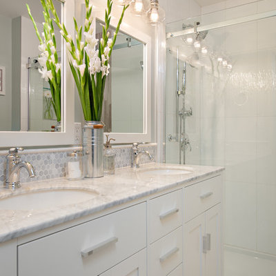 Inspiration for a timeless gray tile and porcelain tile alcove shower remodel in Vancouver with an undermount sink, marble countertops and gray walls