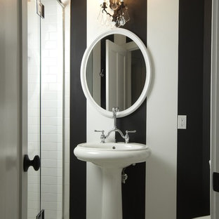 Elegant subway tile and black and white tile bathroom photo in Tampa with a pedestal sink