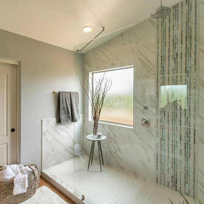 Example of a mid-sized trendy master white tile and porcelain tile terra-cotta tile doorless shower design in Phoenix with gray walls