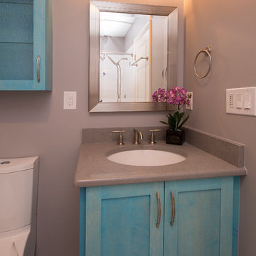 Stunning Aqua Accents in this Guest and Kid's Bathroom