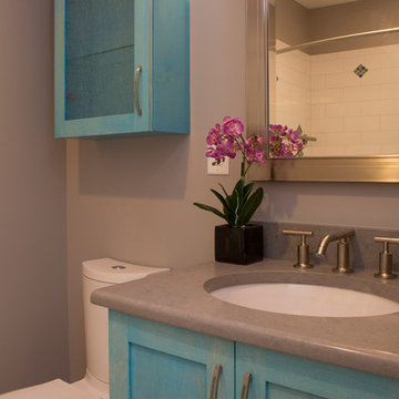 Stunning Aqua Accents in this Guest and Kid's Bathroom