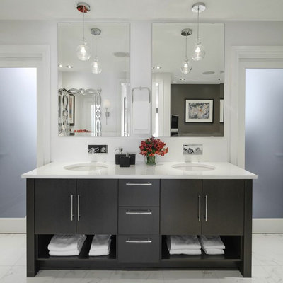 Example of a large trendy master white tile marble floor and white floor bathroom design in Ottawa with an undermount sink, flat-panel cabinets, dark wood cabinets, white walls and marble countertops