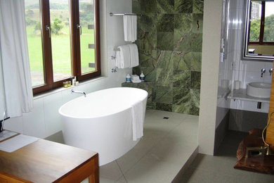 Large traditional ensuite bathroom in Chicago with multi-coloured tiles, ceramic tiles, green walls and ceramic flooring.