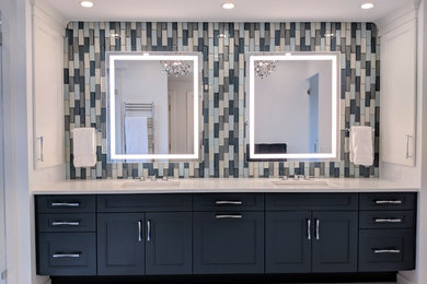 Inspiration for a large modern master blue tile and subway tile marble floor and white floor doorless shower remodel in Boston with shaker cabinets, blue cabinets, white walls, an undermount sink, quartzite countertops, a hinged shower door and white countertops