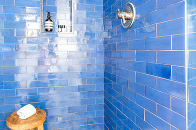 Inspiration for a mid-sized modern 3/4 blue tile and ceramic tile ceramic tile and white floor doorless shower remodel in Minneapolis with recessed-panel cabinets, white cabinets, white walls, a drop-in sink, marble countertops and white countertops