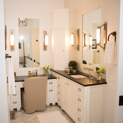 Farmhouse bathroom photo in Columbus with an undermount sink and soapstone countertops