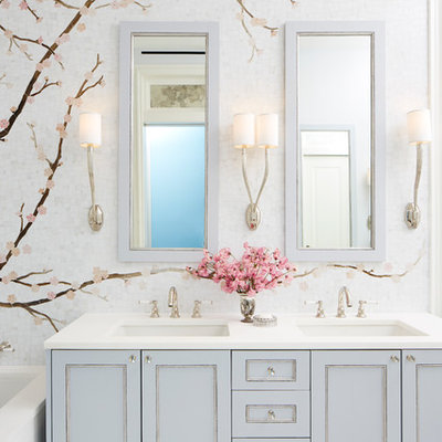 Mid-sized transitional 3/4 multicolored tile and mosaic tile bathroom photo in New York with recessed-panel cabinets, blue cabinets, an undermount sink and quartz countertops