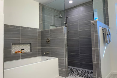 Inspiration for a master gray tile and porcelain tile porcelain tile and gray floor bathroom remodel in Phoenix with shaker cabinets, blue cabinets, a two-piece toilet, white walls, an undermount sink, quartz countertops and white countertops
