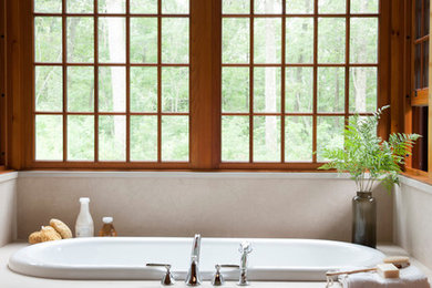 Design ideas for a rustic bathroom in Bridgeport with a built-in bath.
