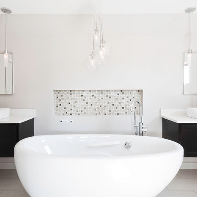 Trendy freestanding bathtub photo in Other with a vessel sink