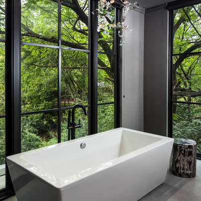 Bathroom - mid-sized contemporary master gray tile and porcelain tile porcelain tile bathroom idea in Dallas with flat-panel cabinets, light wood cabinets, a one-piece toilet, gray walls, an undermount sink and marble countertops