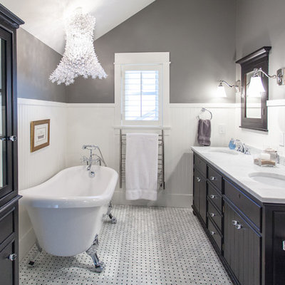 Bathroom - large traditional master white tile white floor and marble floor bathroom idea in Vancouver with an undermount sink, black cabinets, flat-panel cabinets, gray walls, marble countertops and white countertops