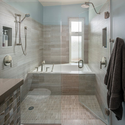 Example of a trendy beige tile and ceramic tile bathroom design in Seattle with blue walls