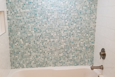 Bathroom - mid-sized modern 3/4 blue tile and mosaic tile porcelain tile, beige floor and single-sink bathroom idea in San Diego with flat-panel cabinets, white cabinets, white walls, an undermount sink, solid surface countertops, white countertops and a freestanding vanity