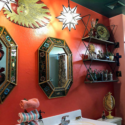 Example of a southwest kids' ceramic tile and beige floor bathroom design in Phoenix with green cabinets, orange walls and white countertops