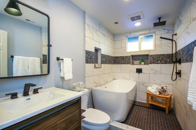 Imagen de cuarto de baño minimalista de tamaño medio con armarios tipo mueble, paredes grises, suelo de baldosas de cerámica y suelo gris