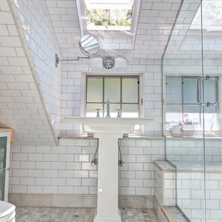 Example of an arts and crafts white tile and subway tile alcove shower design in Philadelphia with a pedestal sink