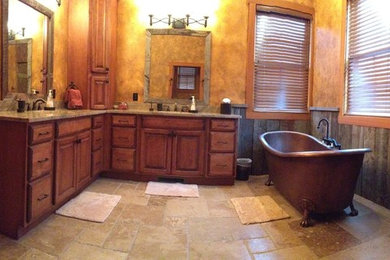 Claw-foot bathtub - mid-sized craftsman master claw-foot bathtub idea in Atlanta with raised-panel cabinets, medium tone wood cabinets, granite countertops and beige walls