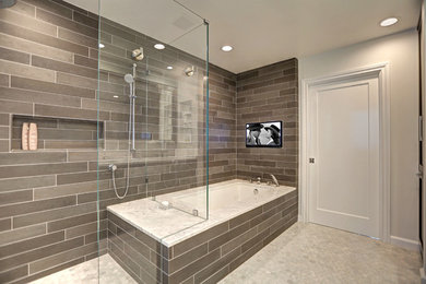 Inspiration for a large modern master gray tile and subway tile porcelain tile corner shower remodel in Los Angeles with recessed-panel cabinets, dark wood cabinets, quartzite countertops, a one-piece toilet, white walls and an undermount tub